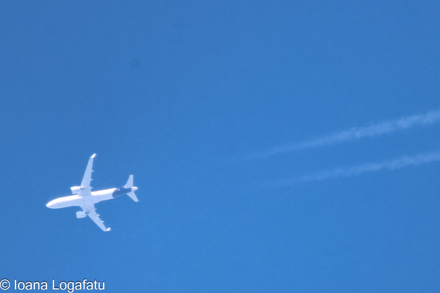 High above the clouds, a jet glides gracefully